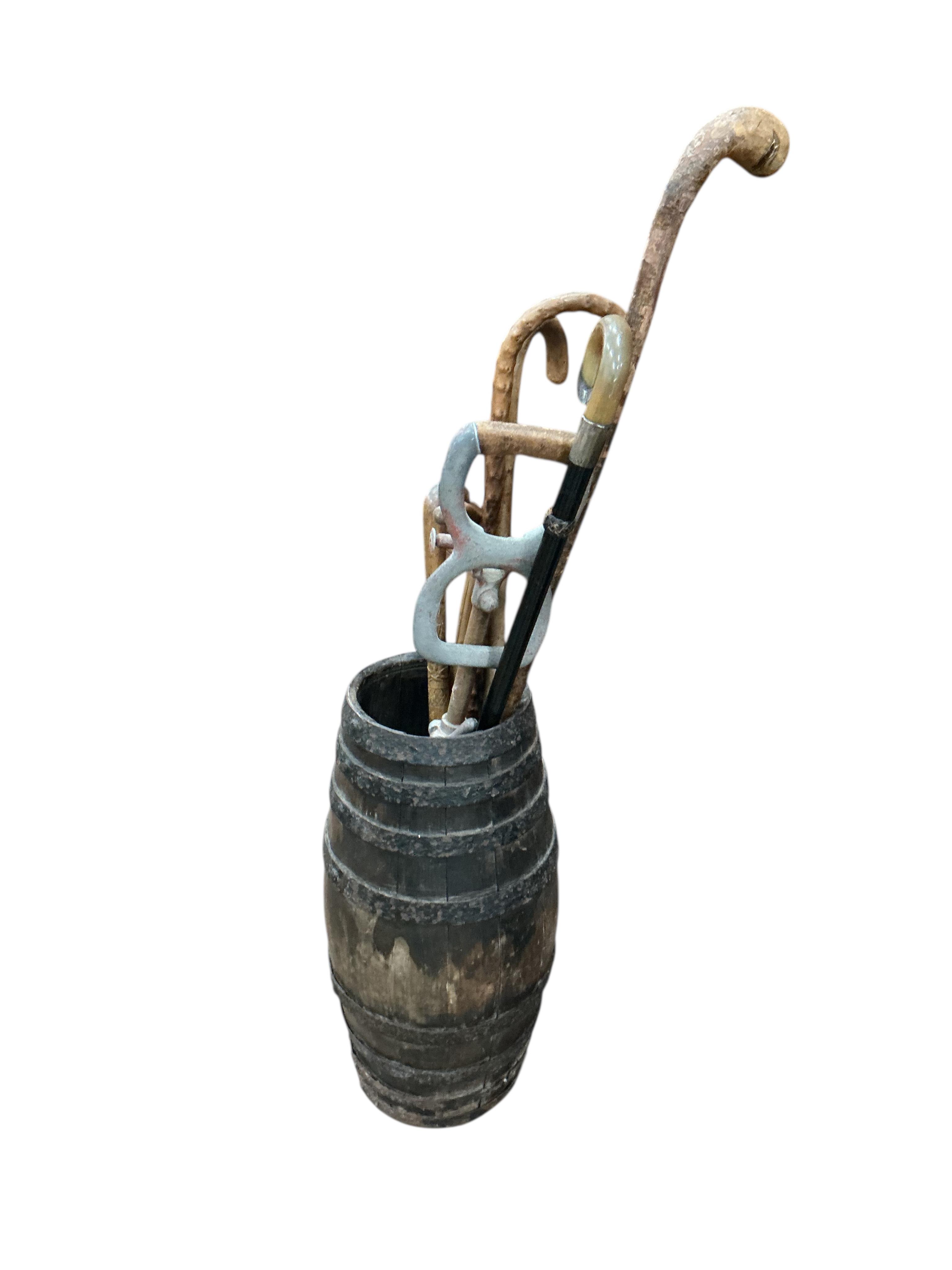 A Victorian iron bound staved stick stand, height 52cm, together with a collection of assorted sticks